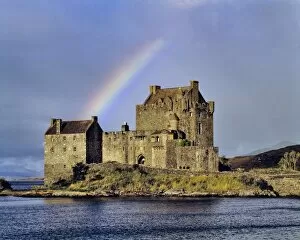 Images Dated 12th May 2011: Scotland, Highland, Wester Ross, Eilean Donan Castle. A rainbow greets visitors at