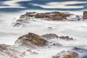Shore Acres State Park, Oregon, USA. Blur of waves flowing over rocks Shore Acres State Park, Oregon, USA. Blur of waves flowing over rocks