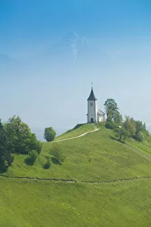 Images Dated 26th May 2004: SLOVENIA-GORENJSKA-Jamnik: Church of St. Prim & Kamnik-Savinja Alps / Morning