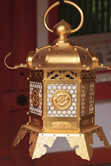 Smaller metal and gold lanterns are representations of their ancient stone siblings Smaller metal and gold lanterns are representations of their ancient stone siblings
