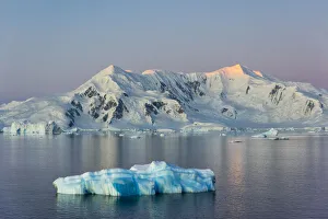 Snow covered island and floating ice in South Atlantic Ocean, Antarctica Snow covered island and floating ice in South Atlantic Ocean, Antarctica