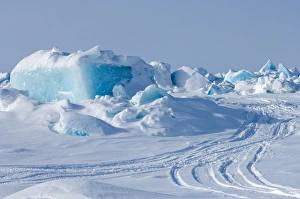 snow machine tracks through jumbled up ice in the frozen Chuckchi Sea during spring whaling season snow machine tracks through jumbled up ice in the frozen Chuckchi Sea during spring whaling season
