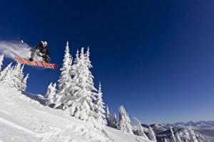 Snowboarding action at Whitefish Mountain Resort in Whitefish, Montana, USA MR Snowboarding action at Whitefish Mountain Resort in Whitefish, Montana, USA MR