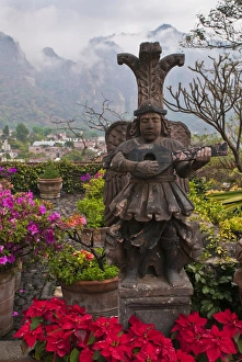 South America, Mexico, Tepoztlan. Flower pots in garden with statue. Credit as: Nancy South America, Mexico, Tepoztlan. Flower pots in garden with statue. Credit as: Nancy