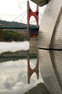 Spain, Bilbao. Guggenheim Museum with mist & bridge reflections Spain, Bilbao. Guggenheim Museum with mist & bridge reflections