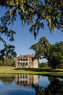 Spanish moss covered tree and the Drayton Hall 18th-century plantation house, Charleston Spanish moss covered tree and the Drayton Hall 18th-century plantation house, Charleston