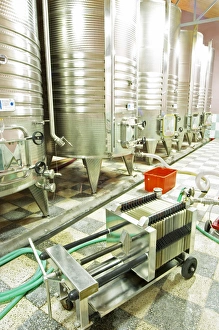 Stainless steel fermentation tanks with cooling coils on the outside. Plate cellulose Stainless steel fermentation tanks with cooling coils on the outside. Plate cellulose