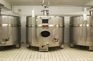 Stainless steel fermentation tanks of an unusual shape wider than they are high Stainless steel fermentation tanks of an unusual shape wider than they are high