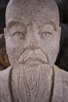 A stone statue of an elderly man in the Jozankei hot springs town on the outskirts of A stone statue of an elderly man in the Jozankei hot springs town on the outskirts of
