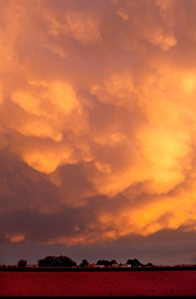Storm clouds at sunset over southwest Idaho. Mammarian clouds are laden with moisture Storm clouds at sunset over southwest Idaho. Mammarian clouds are laden with moisture