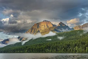 Stormy late afternoon light on Rainbow Peak at Bowman Lake in Glacier National Park Stormy late afternoon light on Rainbow Peak at Bowman Lake in Glacier National Park