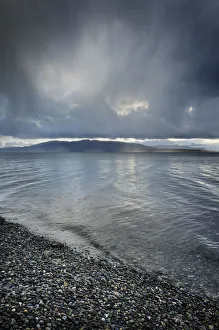 Stormy winter clouds over Bellingham Bay, Washington State. Lummi Island in the distance Stormy winter clouds over Bellingham Bay, Washington State. Lummi Island in the distance