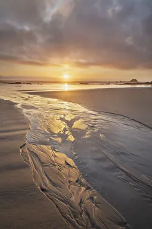 Stream flowing into the Pacific Ocean at sunset, Kalaloch Beach Olympic National Park Stream flowing into the Pacific Ocean at sunset, Kalaloch Beach Olympic National Park