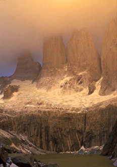 Sunrise glow with clouds at Torres del Paine in the Patagonia region of Chile Sunrise glow with clouds at Torres del Paine in the Patagonia region of Chile
