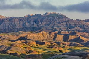 Sunrise light breaks through on a foggy morning in Badlands National Park, South Dakota Sunrise light breaks through on a foggy morning in Badlands National Park, South Dakota