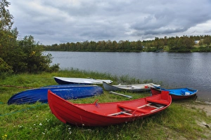 Sweden, Norrbotten. Boats along the Laino River in Lannavaara Sweden, Norrbotten. Boats along the Laino River in Lannavaara