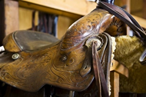 The tack room showing saddles and cowboy boots on The Hideout Ranch in Shell Wyoming The tack room showing saddles and cowboy boots on The Hideout Ranch in Shell Wyoming