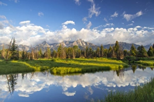 Teton mountains relfect in Schwabacher Landing on the Snake River in Grand Teton National Park Teton mountains relfect in Schwabacher Landing on the Snake River in Grand Teton National Park