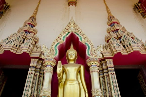Thailand, Ko Samui (aka Koh Samui). Wat Plai Laem, Buddhist temple. Golden Buddha statue Thailand, Ko Samui (aka Koh Samui). Wat Plai Laem, Buddhist temple. Golden Buddha statue
