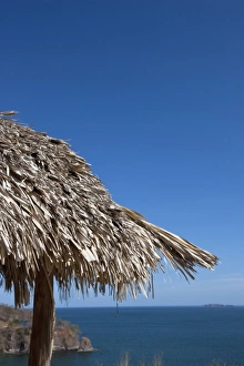 Thatch-roof hut overlooking the ocean in the heart of the Guanacaste Gold Coast Thatch-roof hut overlooking the ocean in the heart of the Guanacaste Gold Coast