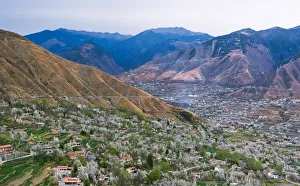 Tibetan village houses with farmland and pear tree blossoms in the valley, Jinchuan Tibetan village houses with farmland and pear tree blossoms in the valley, Jinchuan