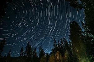 Time lapse photograph showing star trails above the forest near Lake Tahoe, CA Time lapse photograph showing star trails above the forest near Lake Tahoe, CA
