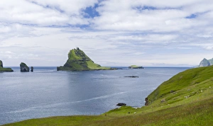 Tindholmur in the Sorvagsfjordur. The island Vagar, part of the Faroe Islands Tindholmur in the Sorvagsfjordur. The island Vagar, part of the Faroe Islands