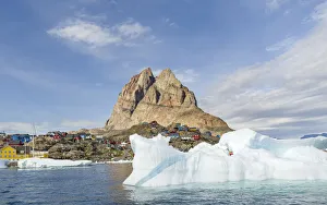 The town Uummannaq, northwest of Greenland, located on an island in the Uummannaq Fjord The town Uummannaq, northwest of Greenland, located on an island in the Uummannaq Fjord