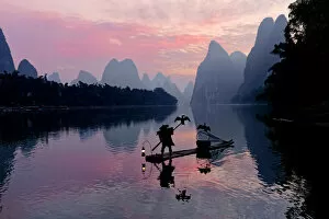 Traditional Chinese cormorant fisherman, Li River, near Xingping, China