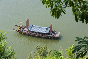 Traditional dragon boat, Baengma river, Buso mountain fortress in the Busosan park Buyeu Traditional dragon boat, Baengma river, Buso mountain fortress in the Busosan park Buyeu
