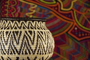 Traditional hand made Panamanian handicrafts. Embera Indian grass basket in front Traditional hand made Panamanian handicrafts. Embera Indian grass basket in front