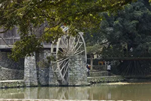 Traditional house and water wheel by the river in Yunshuiyao Village, Nanjing County Traditional house and water wheel by the river in Yunshuiyao Village, Nanjing County