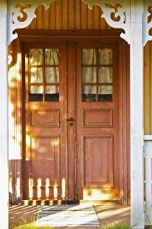Traditional style Swedish wooden painted house. A door Smaland region. Sweden, Europe Traditional style Swedish wooden painted house. A door Smaland region. Sweden, Europe