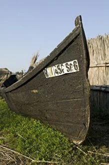 Images Dated 17th July 2004: Traditional tared hull wood boat in boat on land, St George Romania, Danube Delta
