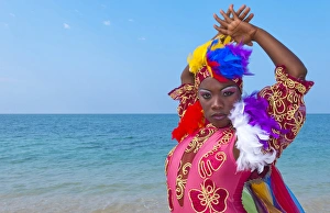 Trinidad Cuba dancers in costume on beautiful beach of ocean with blue water Trinidad Cuba dancers in costume on beautiful beach of ocean with blue water