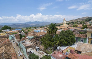 Trinidad Cuba from above tower with church and mountains with buildings of tile roofs Trinidad Cuba from above tower with church and mountains with buildings of tile roofs