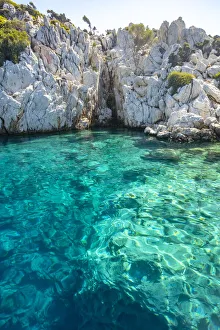 Turquoise colored crystal clear water at a rocky island, Aegean Sea, Turkey Turquoise colored crystal clear water at a rocky island, Aegean Sea, Turkey