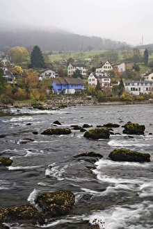 Typical Swiss homes along Rhein River on foggy autumn day, Schaffhausen, Switzerland Typical Swiss homes along Rhein River on foggy autumn day, Schaffhausen, Switzerland
