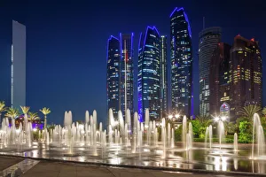 UAE, Abu Dhabi, Emirates Palace Hotel fountains and Etihad Towers, dusk UAE, Abu Dhabi, Emirates Palace Hotel fountains and Etihad Towers, dusk