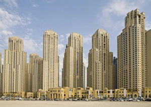 United Arab Emirates, Dubai, Marina. Jumeirah Beach Residence buildings behind beach United Arab Emirates, Dubai, Marina. Jumeirah Beach Residence buildings behind beach