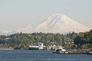 Images Dated 18th May 2011: US, WA, West Seattle. Water taxi approaches Seacrest Dock. Mount Rainier looms to south