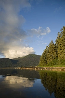 USA, Alaska, Admiralty Island National Monument, Setting sun lights rainforest covered USA, Alaska, Admiralty Island National Monument, Setting sun lights rainforest covered