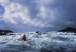 USA, Alaska. Male sea kayaker in 17 ft confused storm seas off Chichagof Island in SE USA, Alaska. Male sea kayaker in 17 ft confused storm seas off Chichagof Island in SE