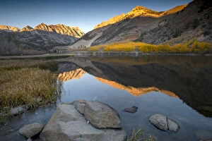 Usa, California, Sierra Nevada. On a freezing autumn morning, North Lake glows with aspen colors