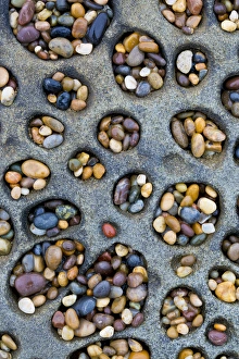 USA, California. Tafoni formation holes filled with pebbles USA, California. Tafoni formation holes filled with pebbles