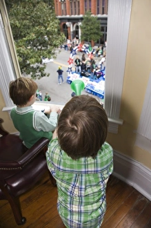 USA; Georgia; Savannah. Two young boys watching the St. Patricks Day Parade.(MR) USA; Georgia; Savannah. Two young boys watching the St. Patricks Day Parade.(MR)