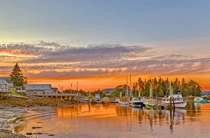 USA, Maine, Acadia, Bass Harbor. Boats rest in harbor at sunset USA, Maine, Acadia, Bass Harbor. Boats rest in harbor at sunset