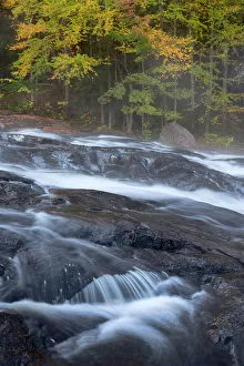 USA, New York State. Buttermilk Falls in autumn, Adirondack Mountains USA, New York State. Buttermilk Falls in autumn, Adirondack Mountains