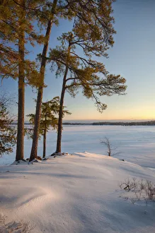 USA, New York State. Winter sunrise along the St. Lawrence River shoreline, Thousand Islands USA, New York State. Winter sunrise along the St. Lawrence River shoreline, Thousand Islands