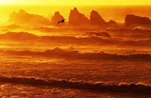 USA, Oregon, Bandon. Sunset over waves and sea stacks USA, Oregon, Bandon. Sunset over waves and sea stacks